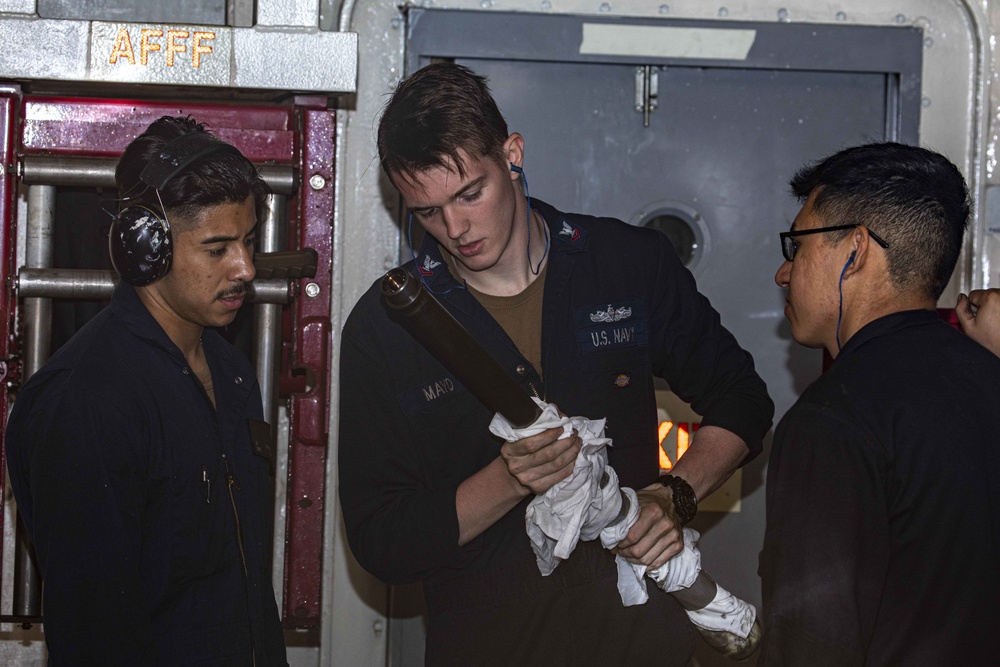 Sailors perform maintenance