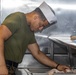 Sailors clean the galley