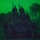 A night vision image showing silhouettes of multiple armed individuals against a bright green background. The image was captured through night vision optics, producing the characteristic green monochrome appearance with visible grain/noise. Several figures carrying what appear to be long-barreled weapons are visible against a treeline.