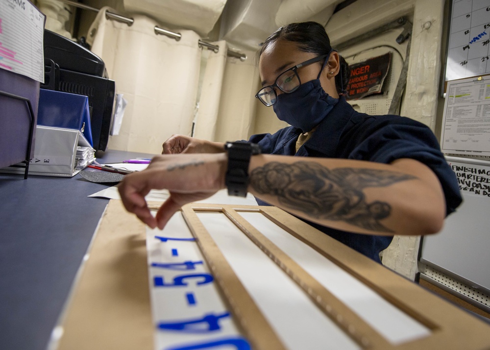 Sailor Conducts Maintenance