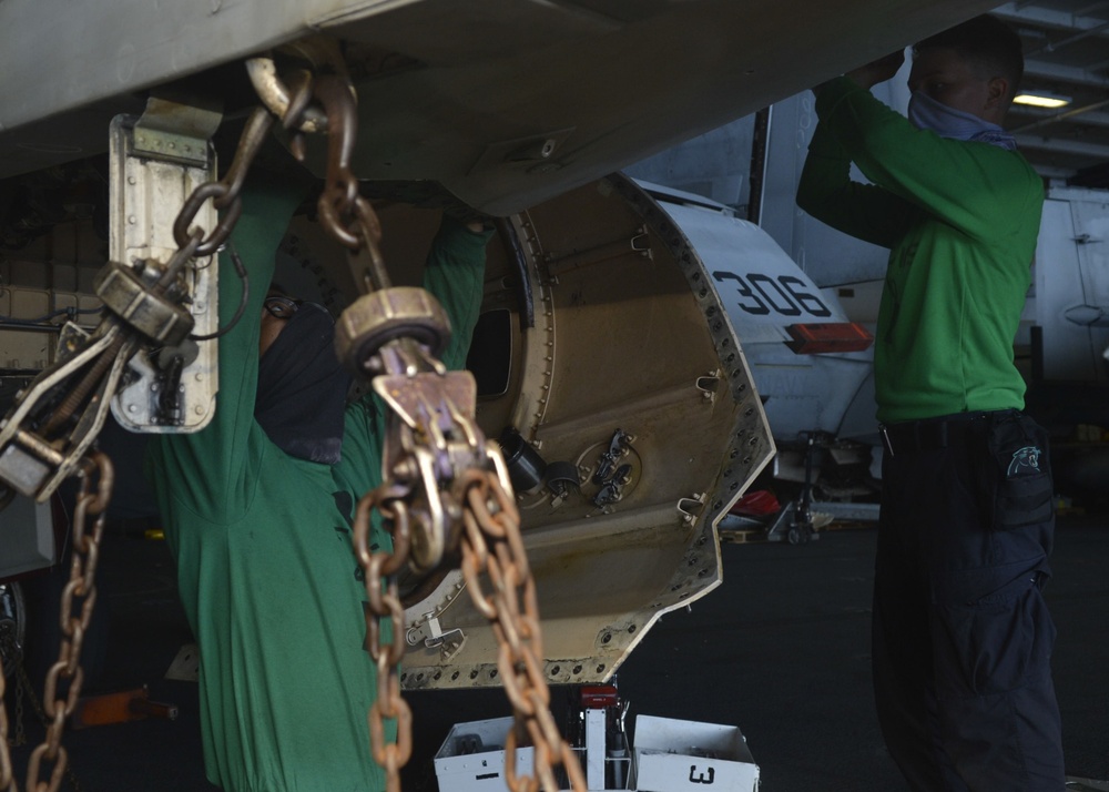 U.S. Navy Sailors Conduct Maintenance on Fighter Jet