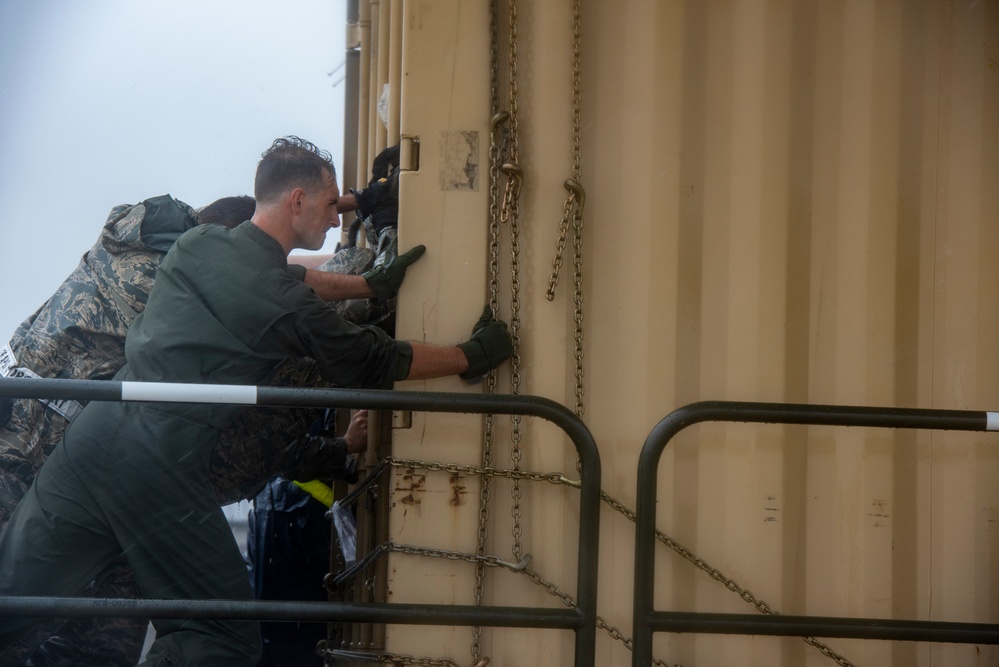 Dover AFB loads cargo during Tropical Storm Fay