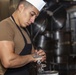 Sailors work in the galley aboard the New York