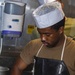 Sailors work in the galley aboard the New York