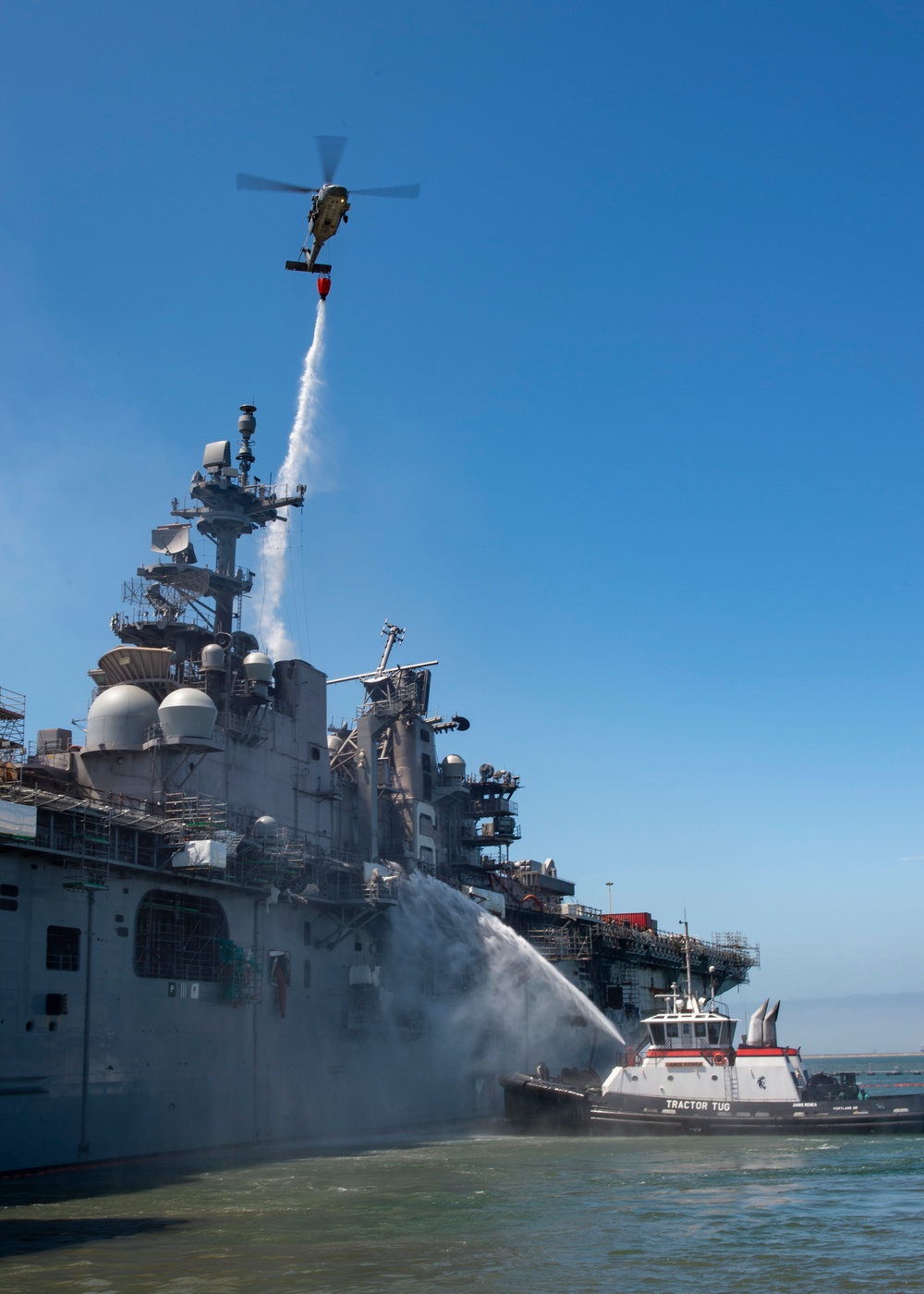 Sailors and Federal San Diego Firefighters fight fire aboard USS Bonhomme Richard