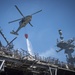 Sailors and Federal San Diego Firefighters fight fire aboard USS Bonhomme Richard