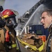 Sailors and Federal San Diego Firefighters fight fire aboard USS Bonhomme Richard