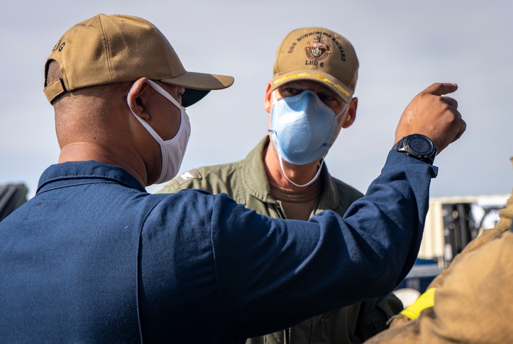 Sailors and Federal San Diego Firefighters fight fire aboard USS Bonhomme Richard