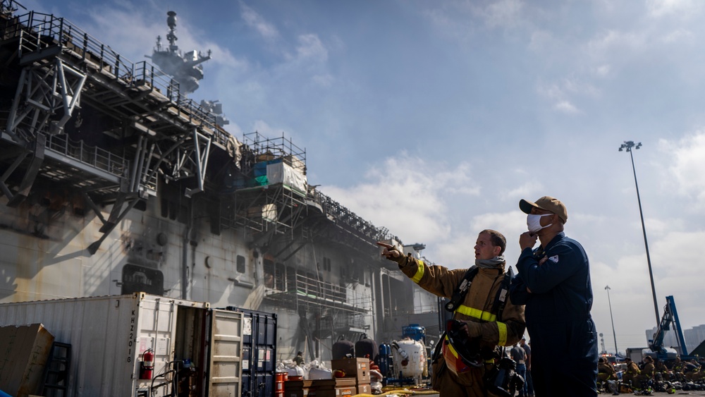 Sailors and Federal San Diego Firefighters fight fire aboard USS Bonhomme Richard