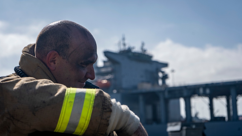 Sailors and Federal San Diego Firefighters fight fire aboard USS Bonhomme Richard