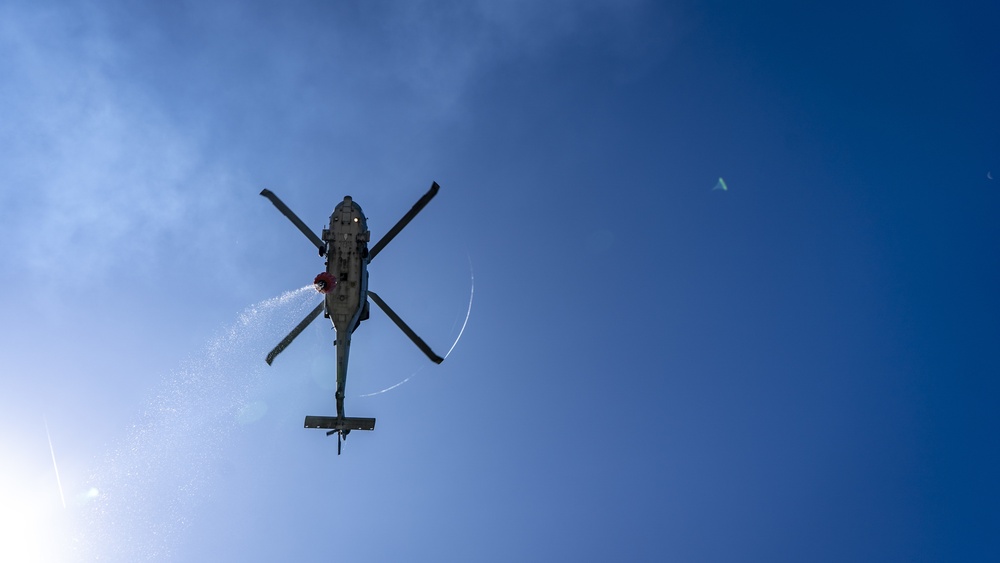 Sailors and Federal San Diego Firefighters fight fire aboard USS Bonhomme Richard