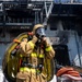 Sailors and Federal San Diego Firefighters fight fire aboard USS Bonhomme Richard