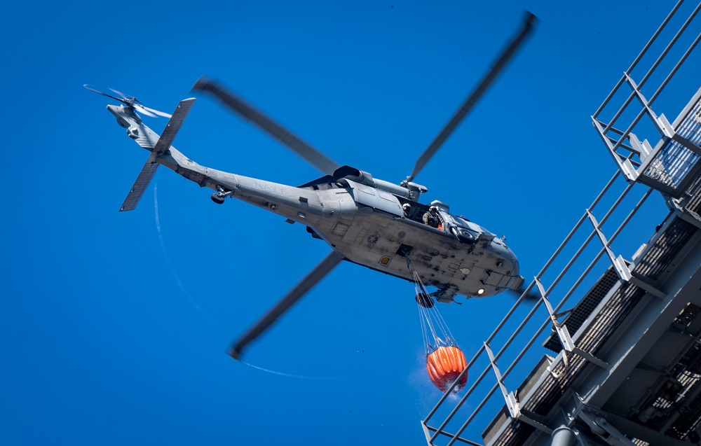 Sailors and Federal San Diego Firefighters fight fire aboard USS Bonhomme Richard