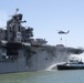 Sailors and Federal San Diego Firefighters fight fire aboard USS Bonhomme Richard