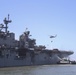 Sailors and federal San Diego firefighters fight fire aboard USS Bonhomme Richard