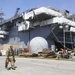 Sailors and federal San Diego firefighters fight fire aboard USS Bonhomme Richard