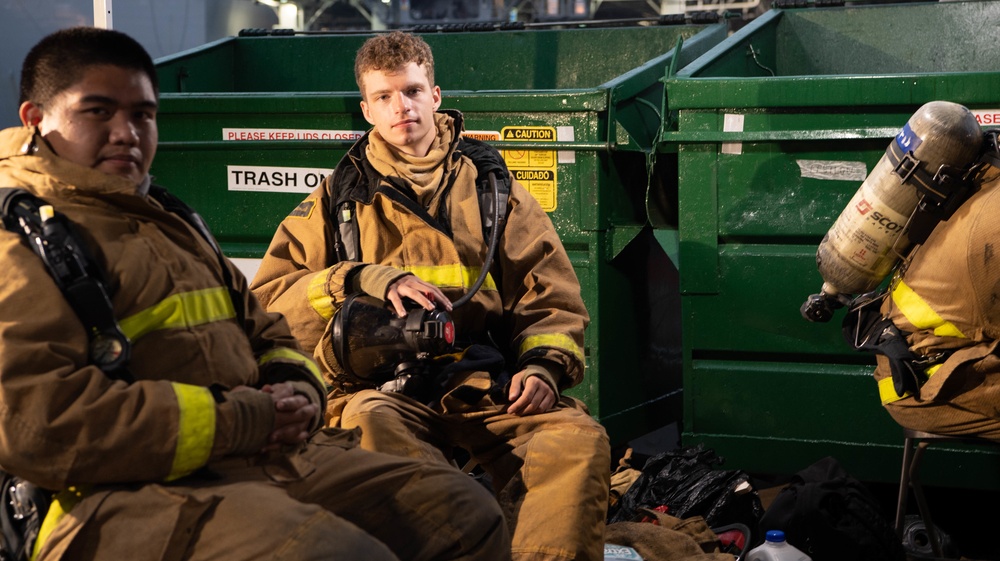 Sailors and Federal San Diego Firefighters fight fire aboard USS Bonhomme Richard