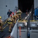 Sailors and Federal San Diego Firefighters fight fire aboard USS Bonhomme Richard