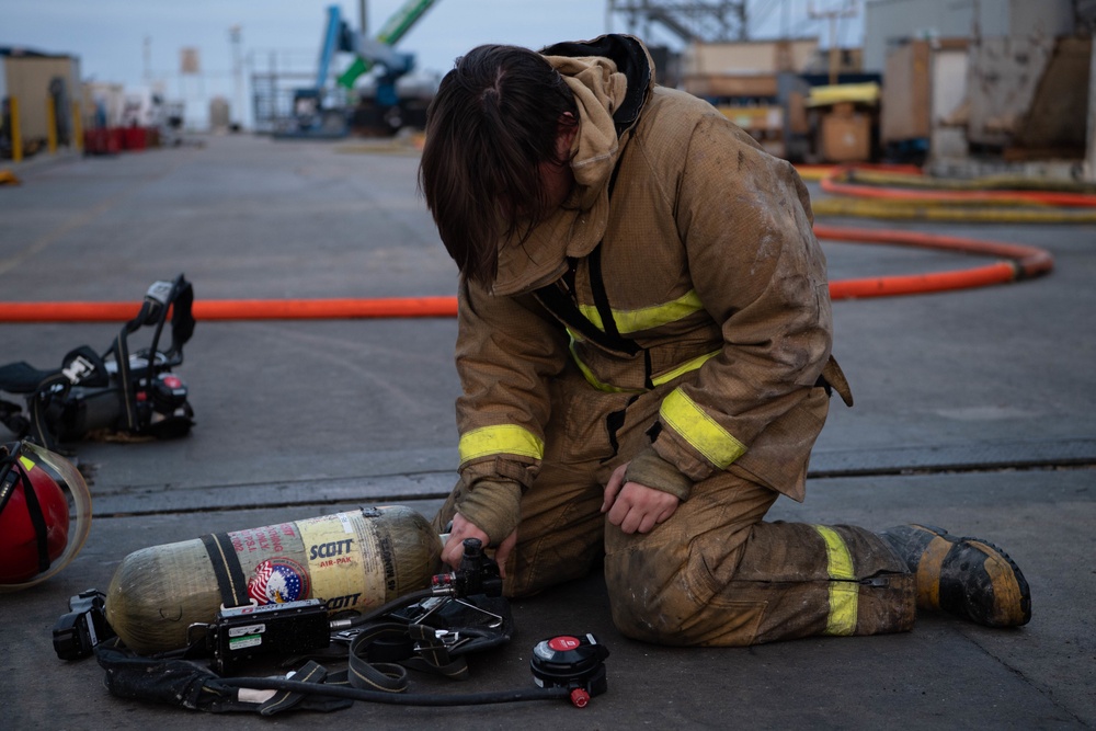 Sailors and Federal San Diego Firefighters fight fire aboard USS Bonhomme Richard