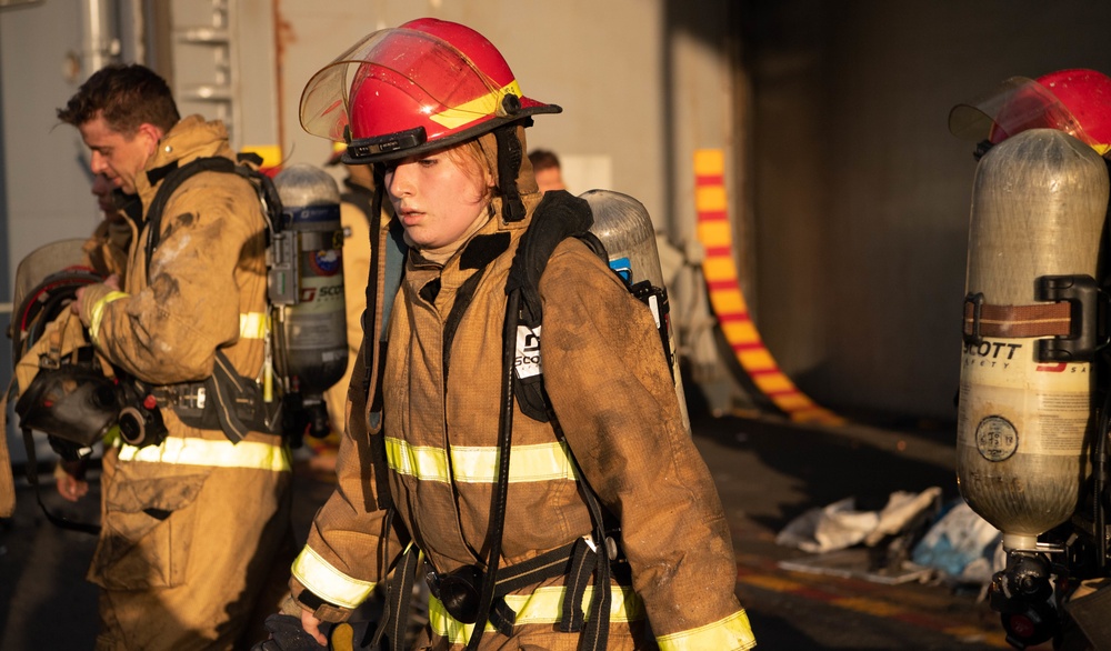 Sailors and Federal San Diego Firefighters fight fire aboard USS Bonhomme Richard