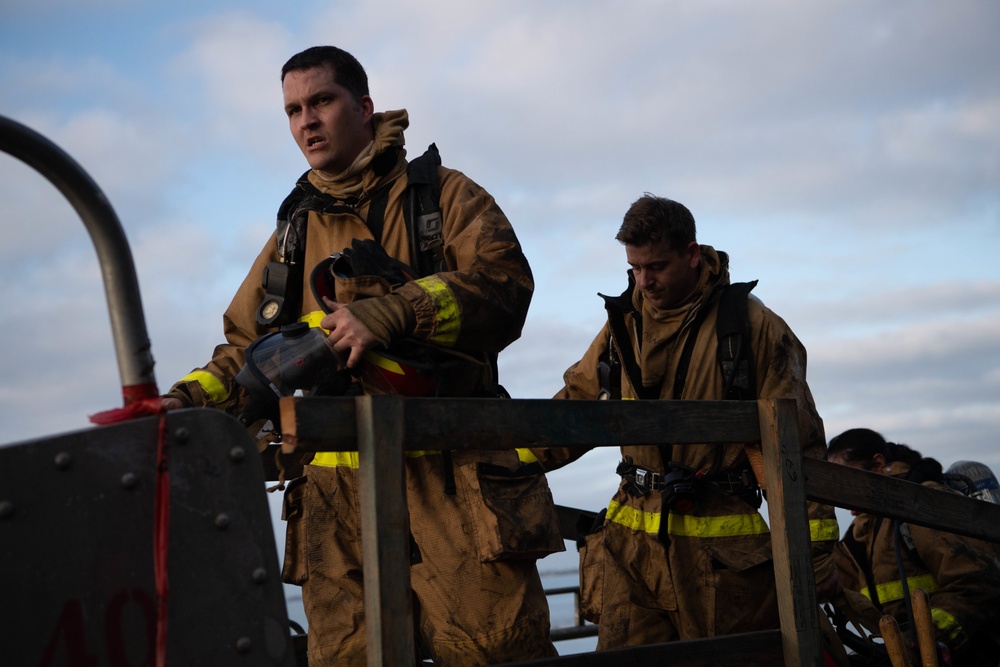 Sailors and Federal San Diego Firefighters fight fire aboard USS Bonhomme Richard