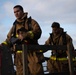 Sailors and Federal San Diego Firefighters fight fire aboard USS Bonhomme Richard