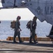 Sailors and Marines take part in flight operations