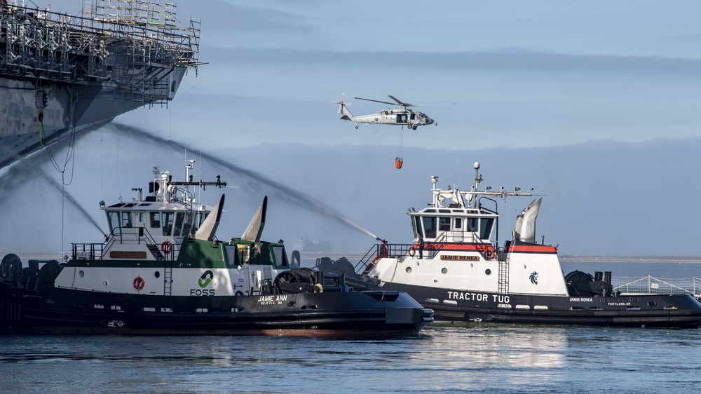 Sailors and Federal San Diego Firefighters fight fire aboard USS Bonhomme Richard