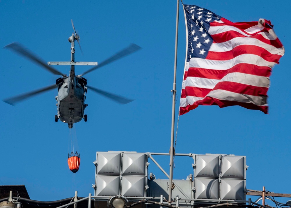 Sailors and Federal San Diego Firefighters fight fire aboard USS Bonhomme Richard