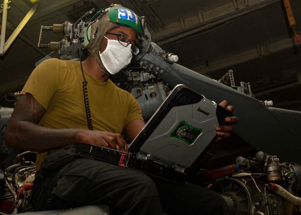 U.S. Navy Sailors Prepare Helicopter for Flight Operations