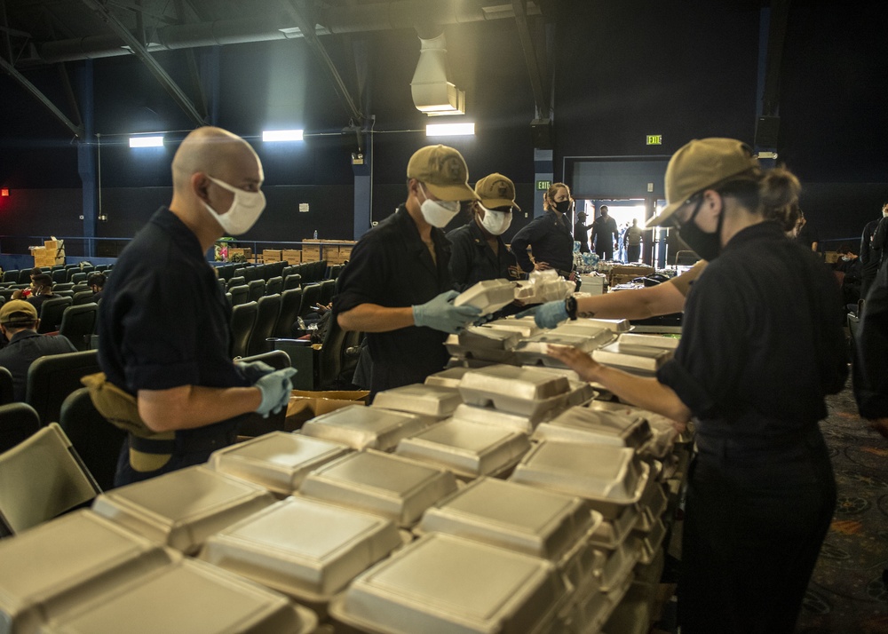 Sailors and federal San Diego firefighters fight fire aboard USS Bonhomme Richard