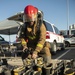 Sailors and federal San Diego firefighters fight fire aboard USS Bonhomme Richard