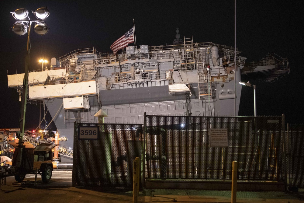 Sailors and federal San Diego firefighters fight fire aboard USS Bonhomme Richard