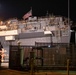 Sailors and federal San Diego firefighters fight fire aboard USS Bonhomme Richard