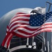 The U.S. flag flies with the Commander, Destroyer Squadron (DESRON) 31 command pennant