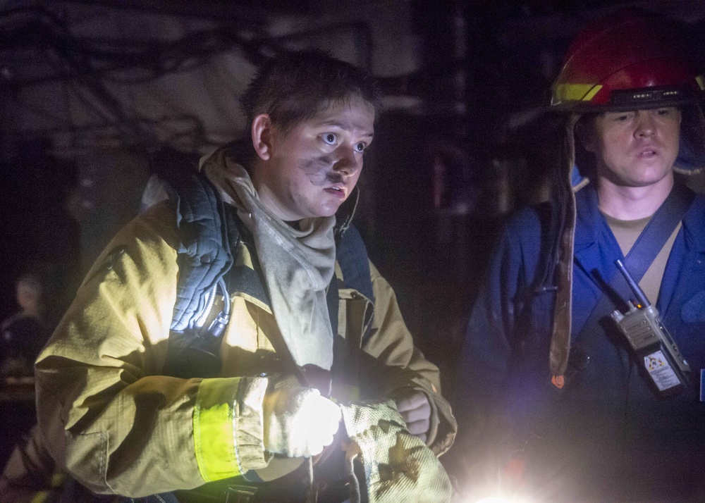 Sailors and Federal San Diego Firefighters fight fire aboard USS Bonhomme Richard