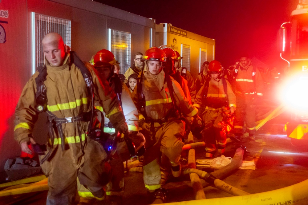 Sailors and Federal San Diego Firefighters fight fire aboard USS Bonhomme Richard