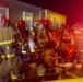 Sailors and Federal San Diego Firefighters fight fire aboard USS Bonhomme Richard