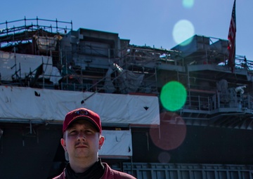 Sailors and federal San Diego firefighters fight fire aboard USS Bonhomme Richard