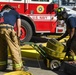 Sailors and federal San Diego firefighters fight fire aboard USS Bonhomme Richard