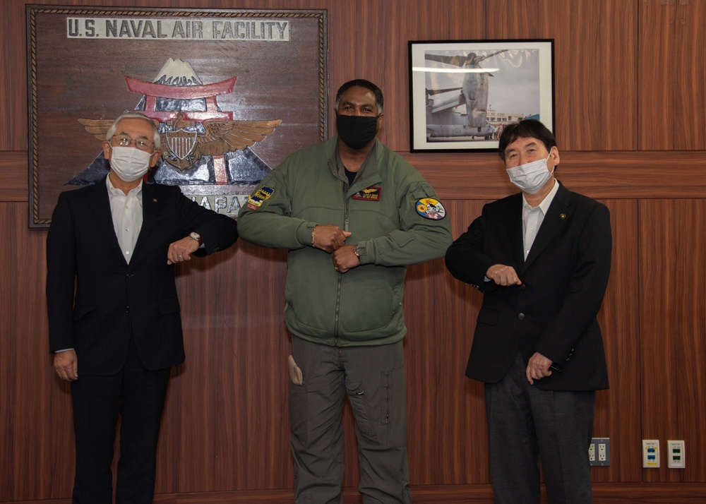 Capt. Lloyd B. Mack greets Ayase city and Yamato city mayors