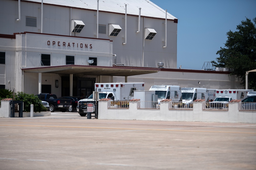 Audie Murphy receives help with patient transport