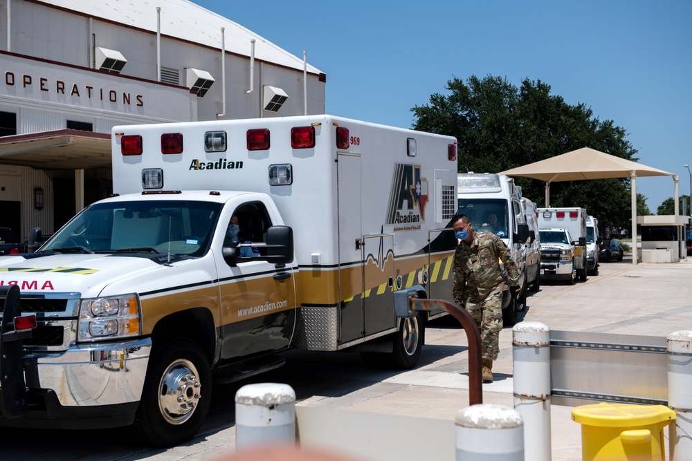 Audie Murphy receives help with patient transport