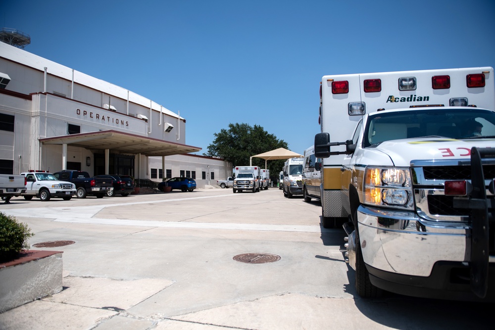 Audie Murphy receives help with patient transport