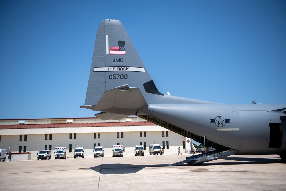 Audie Murphy receives help with patient transport