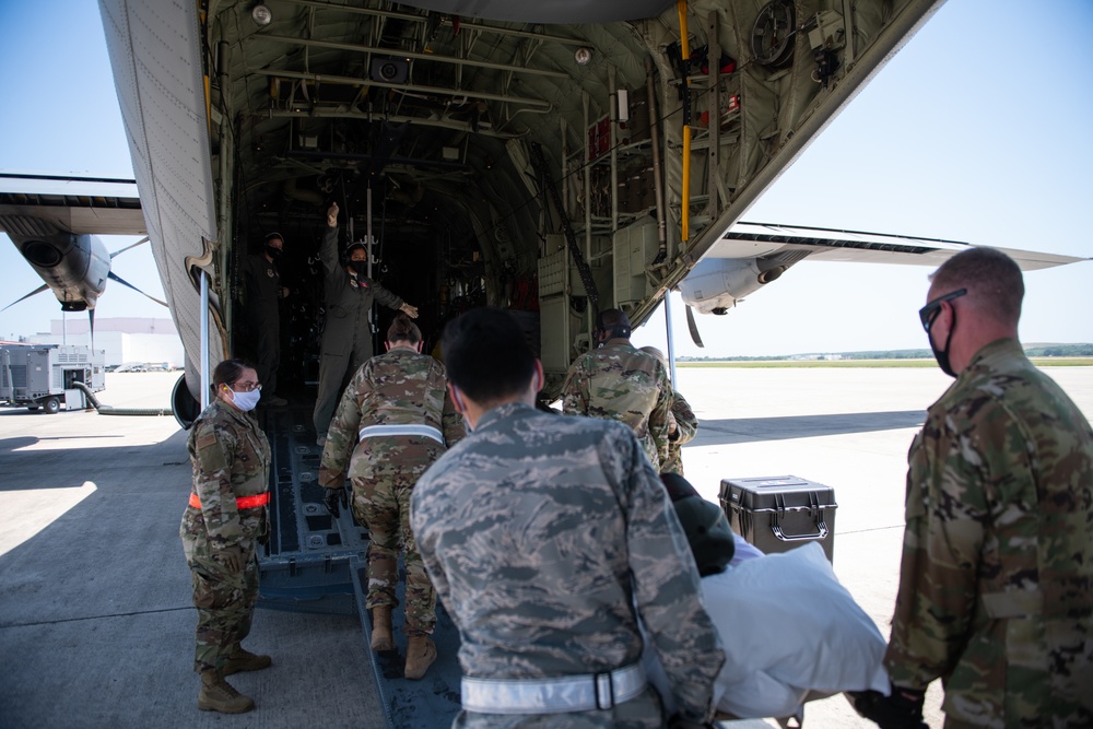 Audie Murphy receives help with patient transport