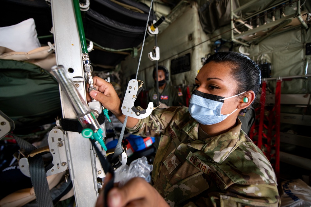 Audie Murphy receives help with patient transport