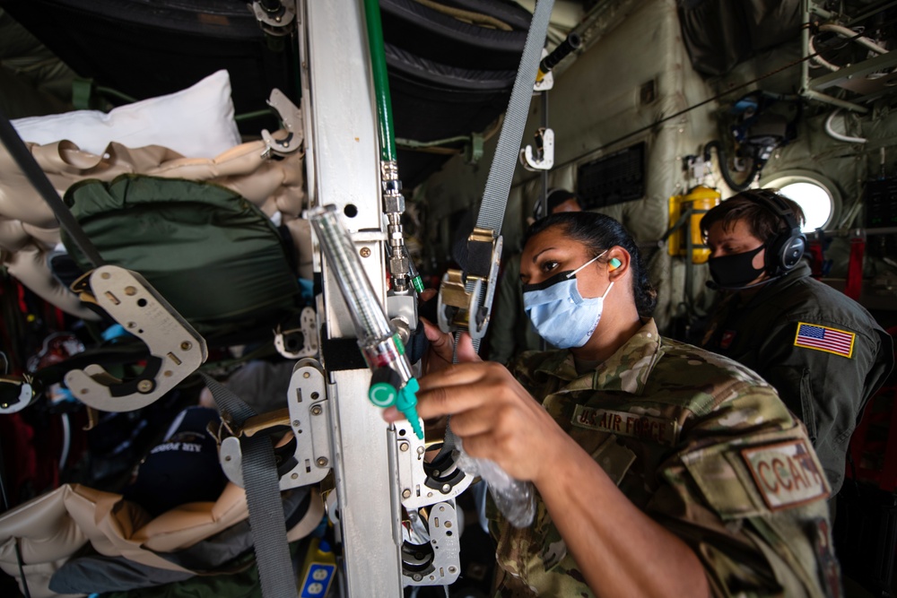 Audie Murphy receives help with patient transport