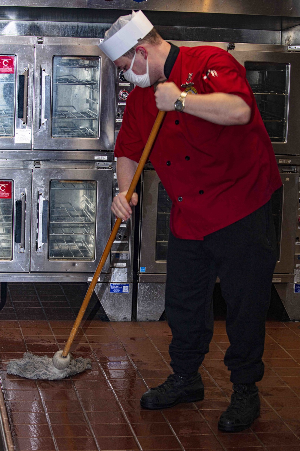 Sailors work in the galley