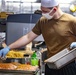 Sailors work in the galley